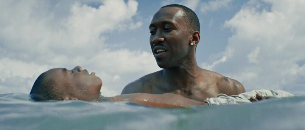 Moonlight Still; Mahershala Ali teaching Alex Hibbert to swim