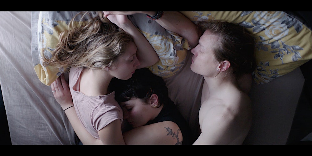 Jasmine Sumner (left), Sol Baldi (middle), and Charlie Rich (right) in bed