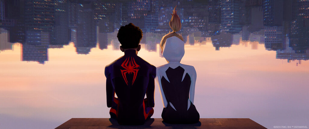 The backs of Miles and Gwen, sat upside down looking at the city skyline