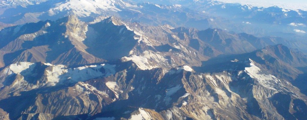 The Andes mountain range as seen from a plane, between Santiago de Chile and Mendoza, Argentina, in summer.